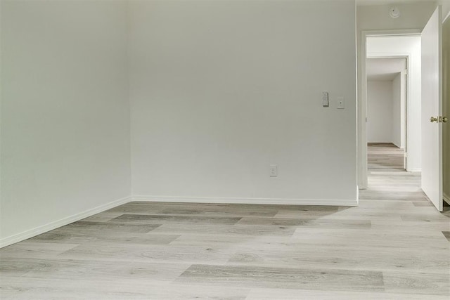 648 NW 18th St, Moore, OK 73160 - empty room featuring light wood finished floors and a smoke detector