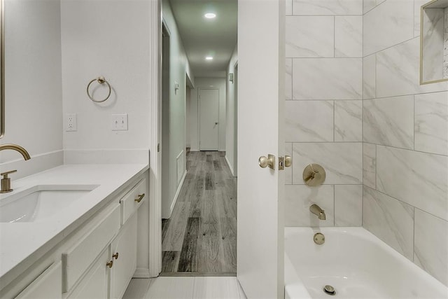 648 NW 18th St, Moore, OK 73160 - full bathroom featuring vanity, bathtub / shower combination, recessed lighting, and wood finished floors