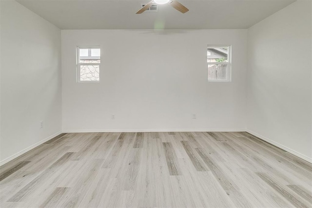 648 NW 18th St, Moore, OK 73160 - unfurnished room with healthy amount of natural light, light wood finished floors, and ceiling fan