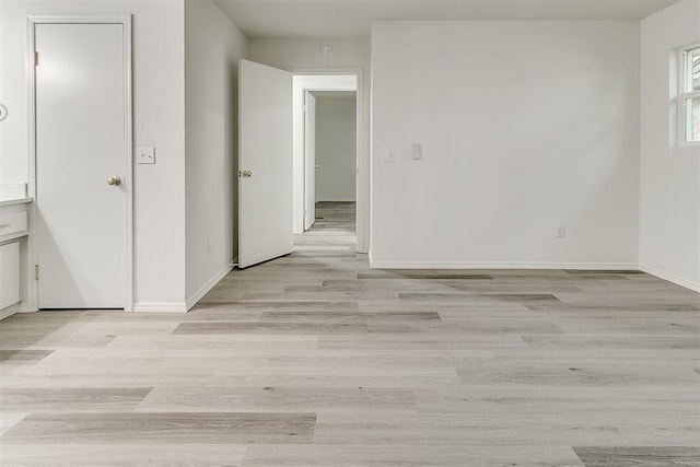 648 NW 18th St, Moore, OK 73160 - unfurnished room featuring light wood finished floors and baseboards