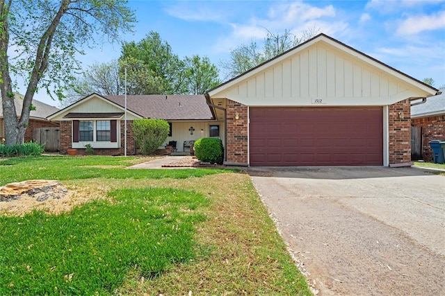 1912 Magnolia Ln, Edmond, OK 73013 - ranch-style house featuring brick siding, driveway, a front lawn, and an attached garage