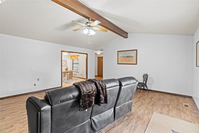 1912 Magnolia Ln, Edmond, OK 73013 - home theater room featuring ceiling fan and light wood-style floors