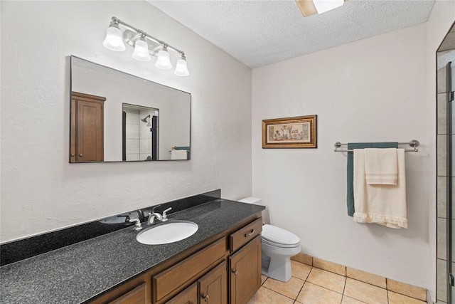 1912 Magnolia Ln, Edmond, OK 73013 - bathroom with vanity, tile patterned floors, a textured ceiling, and a shower