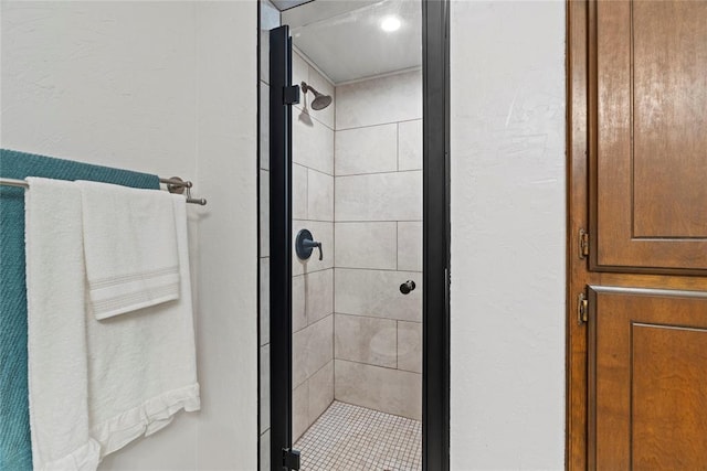 1912 Magnolia Ln, Edmond, OK 73013 - bathroom featuring a stall shower and a textured wall