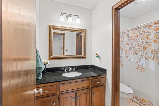 1912 Magnolia Ln, Edmond, OK 73013 - full bathroom featuring vanity, a shower with shower curtain, tile patterned flooring, and a textured ceiling