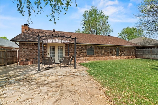 1912 Magnolia Ln, Edmond, OK 73013 - rear view of house featuring a pergola, brick siding, a patio, a fenced backyard, and a chimney