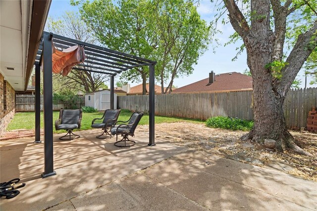 1912 Magnolia Ln, Edmond, OK 73013 - fenced backyard with a storage unit, a patio, and a pergola