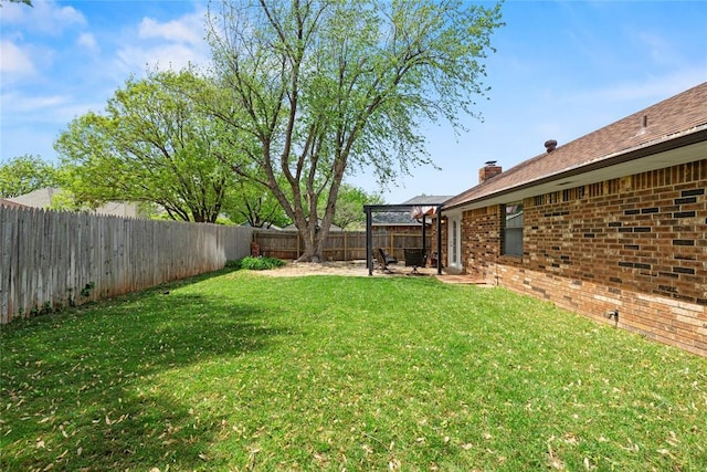 1912 Magnolia Ln, Edmond, OK 73013 - fenced backyard with a patio area