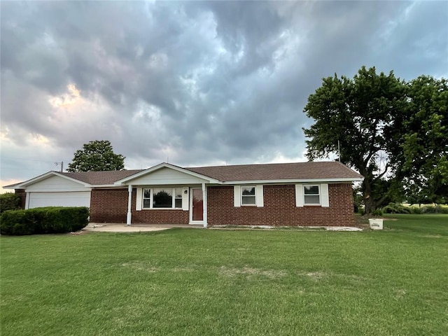 13090 County Road 1140, Lookeba, OK 73053 - ranch-style home featuring a front lawn, brick siding, and an attached garage
