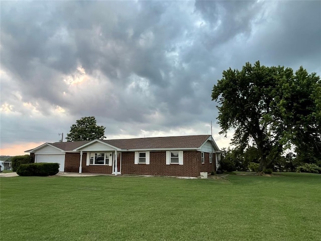 13090 County Road 1140, Lookeba, OK 73053 - ranch-style house with an attached garage, a front lawn, and brick siding
