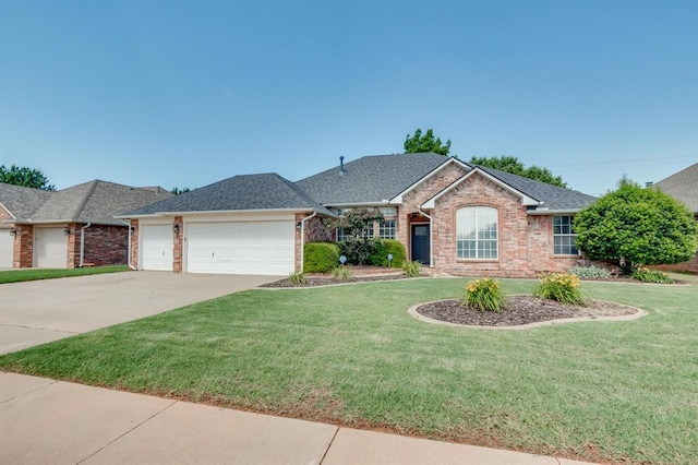 613 N Remington Way, Mustang, OK 73064 - single story home featuring brick siding, a garage, a front yard, and driveway