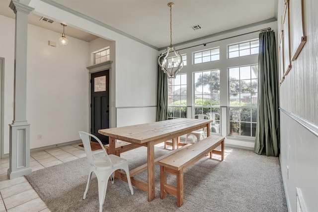 613 N Remington Way, Mustang, OK 73064 - dining room featuring light tile patterned flooring, a chandelier, and ornate columns