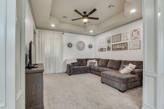 613 N Remington Way, Mustang, OK 73064 - carpeted living area featuring ceiling fan, a tray ceiling, and recessed lighting