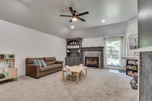 613 N Remington Way, Mustang, OK 73064 - living room featuring carpet flooring, a tiled fireplace, a ceiling fan, recessed lighting, and lofted ceiling