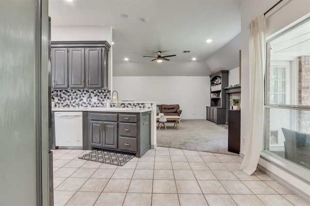 613 N Remington Way, Mustang, OK 73064 - kitchen with white dishwasher, gray cabinets, light colored carpet, ceiling fan, and open floor plan