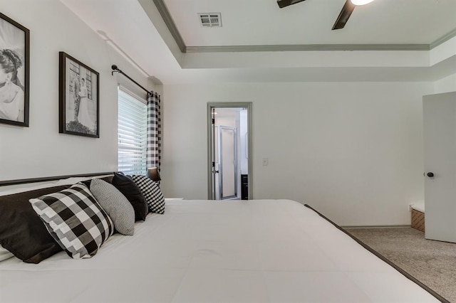 613 N Remington Way, Mustang, OK 73064 - bedroom with crown molding, a tray ceiling, and ceiling fan