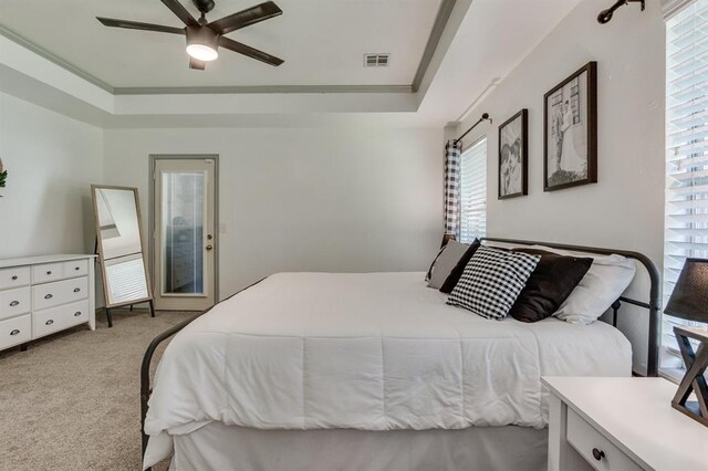 613 N Remington Way, Mustang, OK 73064 - bedroom featuring carpet floors, a raised ceiling, ceiling fan, and crown molding