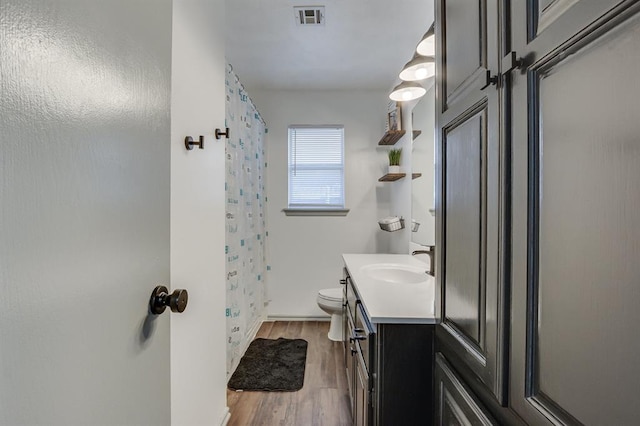 613 N Remington Way, Mustang, OK 73064 - full bath with wood finished floors, vanity, and curtained shower