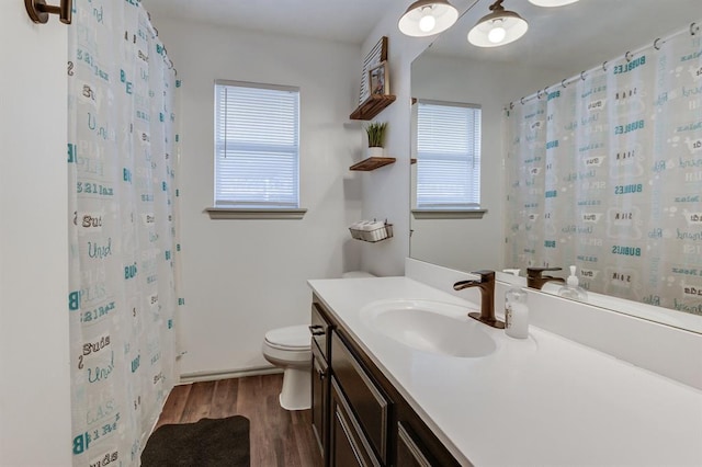 613 N Remington Way, Mustang, OK 73064 - bathroom with wood finished floors, vanity, and a shower with curtain