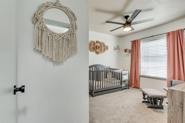 613 N Remington Way, Mustang, OK 73064 - bedroom with carpet, a crib, and ceiling fan