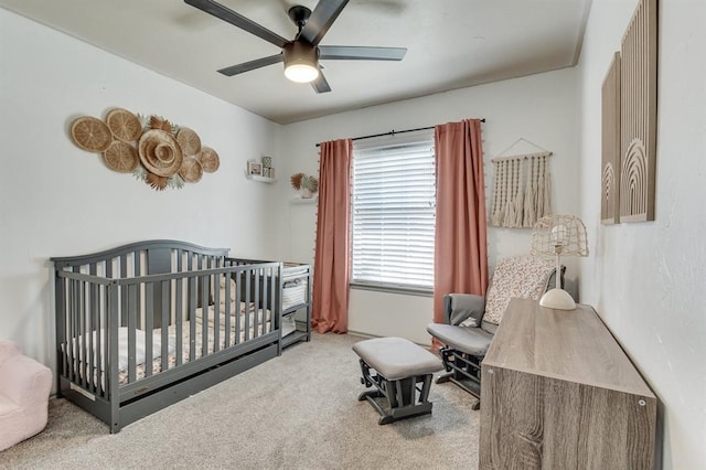 613 N Remington Way, Mustang, OK 73064 - carpeted bedroom with a nursery area and a ceiling fan