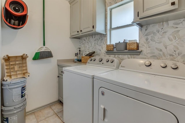 613 N Remington Way, Mustang, OK 73064 - laundry room featuring washer and clothes dryer, cabinet space, and light tile patterned floors