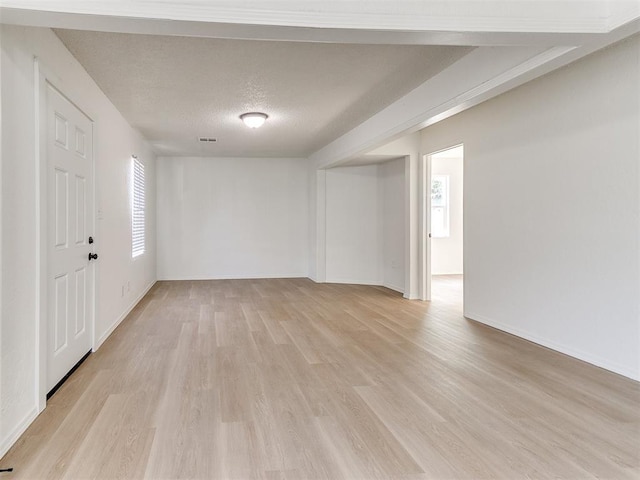 2924 SW 51st St, Oklahoma City, OK 73119 - spare room with light wood-style floors and a textured ceiling