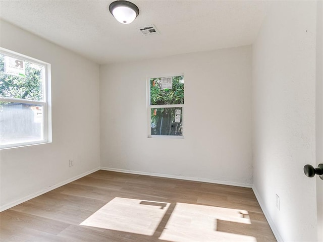 2924 SW 51st St, Oklahoma City, OK 73119 - unfurnished room with healthy amount of natural light and wood finished floors