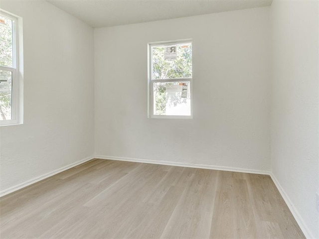 2924 SW 51st St, Oklahoma City, OK 73119 - spare room featuring light wood-style floors and baseboards