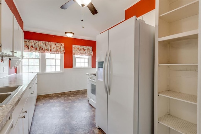 2705 NW 21st St, Oklahoma City, OK 73107 - kitchen featuring white appliances, ceiling fan, white cabinetry, light countertops, and open shelves