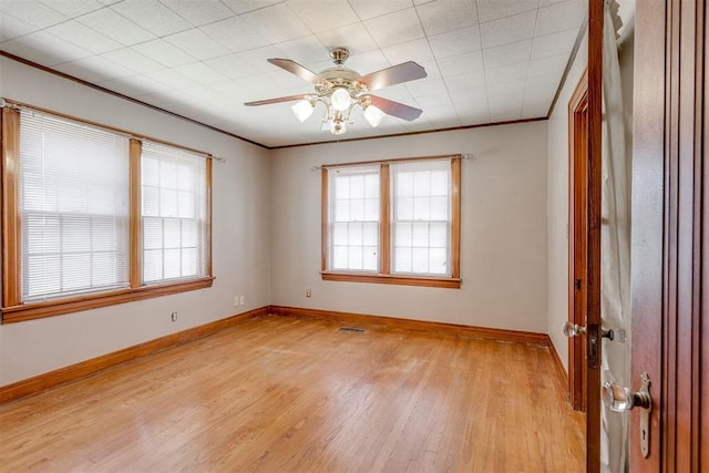 2705 NW 21st St, Oklahoma City, OK 73107 - unfurnished room featuring light wood-style floors, ornamental molding, and ceiling fan