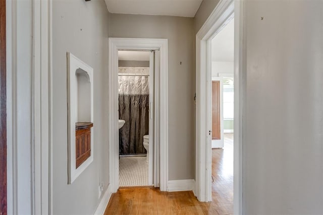 2705 NW 21st St, Oklahoma City, OK 73107 - hall featuring light wood finished floors and baseboards