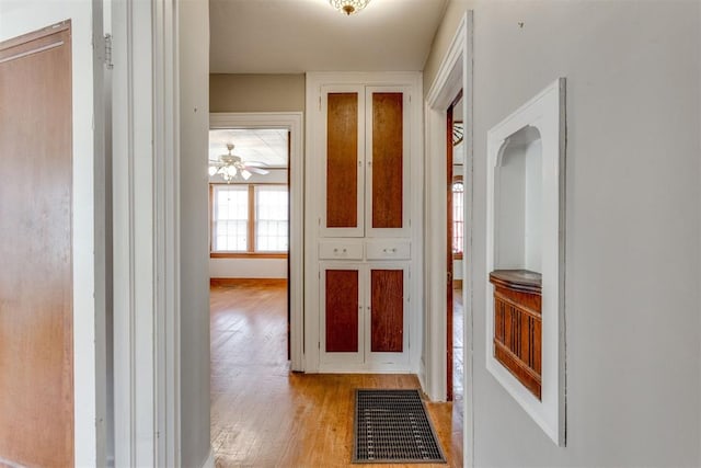 2705 NW 21st St, Oklahoma City, OK 73107 - corridor featuring wood finished floors and baseboards