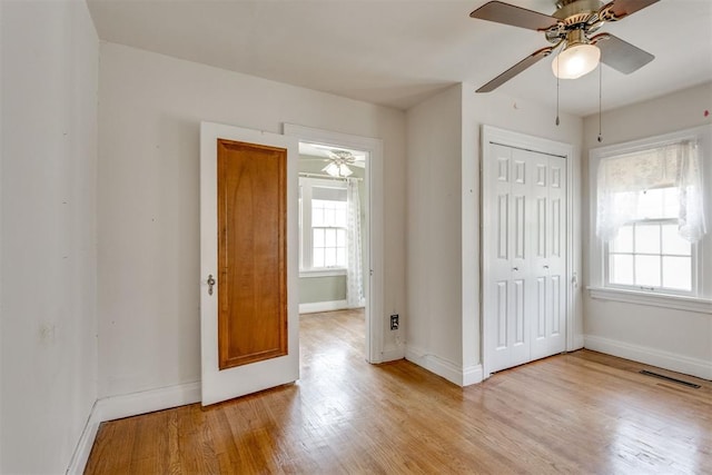 2705 NW 21st St, Oklahoma City, OK 73107 - unfurnished bedroom featuring light wood-style flooring, a closet, and ceiling fan