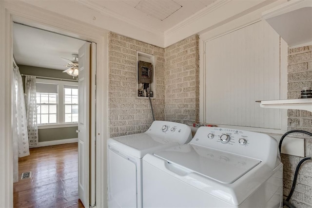 2705 NW 21st St, Oklahoma City, OK 73107 - laundry area featuring ceiling fan, washing machine and clothes dryer, wood finished floors, and crown molding