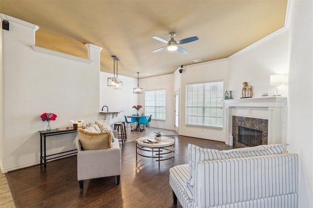 619 SW 28th St, Moore, OK 73160 - living room featuring a ceiling fan, ornamental molding, wood finished floors, and a high end fireplace