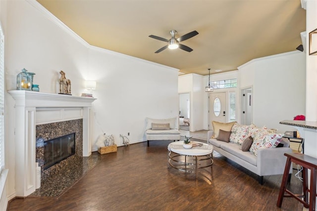 619 SW 28th St, Moore, OK 73160 - living room featuring a ceiling fan, wood finished floors, ornamental molding, and a premium fireplace