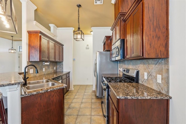 619 SW 28th St, Moore, OK 73160 - kitchen with appliances with stainless steel finishes, decorative backsplash, a peninsula, pendant lighting, and light tile patterned floors