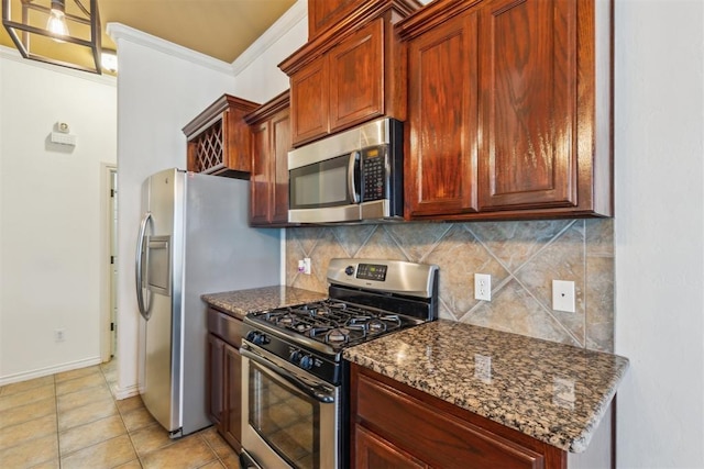 619 SW 28th St, Moore, OK 73160 - kitchen with stainless steel appliances, tasteful backsplash, dark stone counters, and light tile patterned flooring