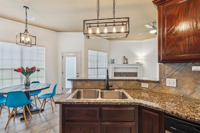 619 SW 28th St, Moore, OK 73160 - kitchen with dishwasher, a peninsula, ornamental molding, tasteful backsplash, and light tile patterned floors