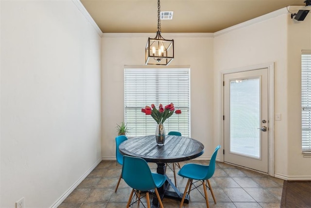 619 SW 28th St, Moore, OK 73160 - tiled dining area with a chandelier and ornamental molding