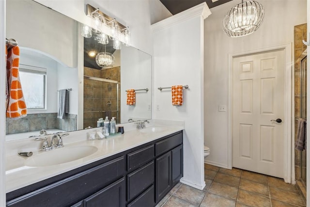619 SW 28th St, Moore, OK 73160 - bathroom with a stall shower, double vanity, a chandelier, and tile patterned floors