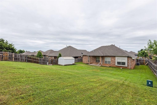 619 SW 28th St, Moore, OK 73160 - fenced backyard featuring a storage shed