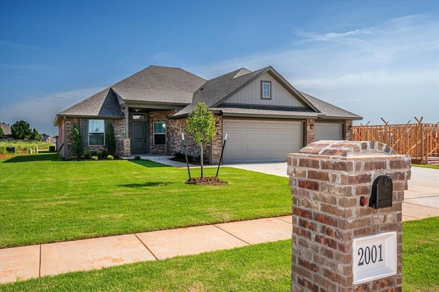 2001 W Crossbow Way, Mustang, OK 73065 - view of front of property featuring an attached garage, concrete driveway, brick siding, and a shingled roof
