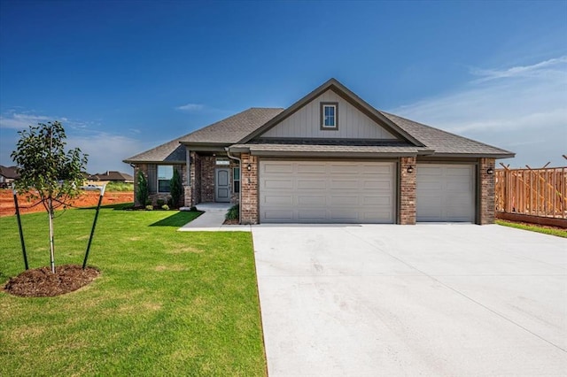 2001 W Crossbow Way, Mustang, OK 73065 - craftsman-style house with a garage, driveway, brick siding, and a shingled roof