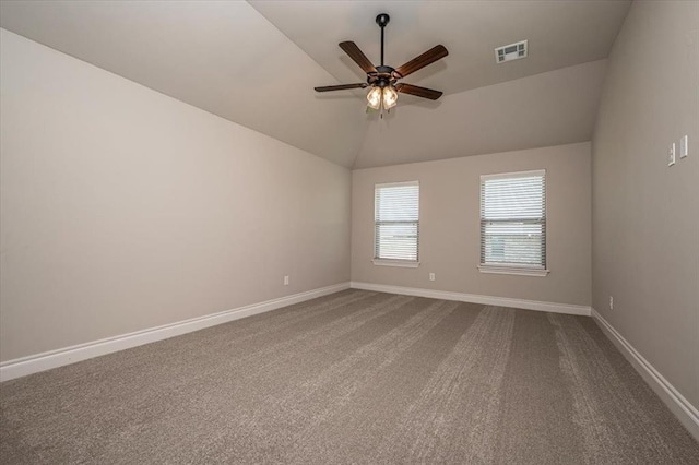 2001 W Crossbow Way, Mustang, OK 73065 - spare room with a ceiling fan, vaulted ceiling, and dark colored carpet