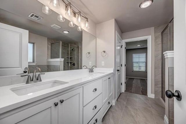 2001 W Crossbow Way, Mustang, OK 73065 - bathroom featuring double vanity and a shower stall