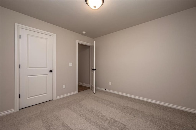 2001 W Crossbow Way, Mustang, OK 73065 - unfurnished bedroom featuring baseboards and carpet floors