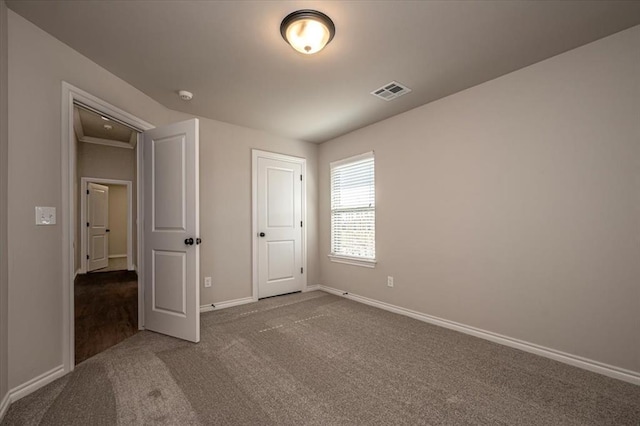 2001 W Crossbow Way, Mustang, OK 73065 - unfurnished bedroom with carpet floors and baseboards