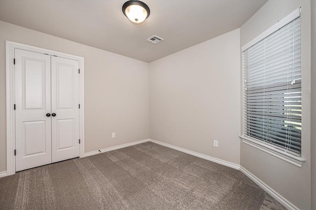 2001 W Crossbow Way, Mustang, OK 73065 - unfurnished bedroom with carpet flooring and a closet